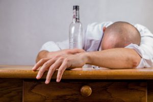 drunk person passed out on a table
