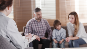 couple with son consulting divorce lawyer
