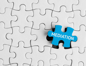 Puzzle with puzzle piece that says mediation