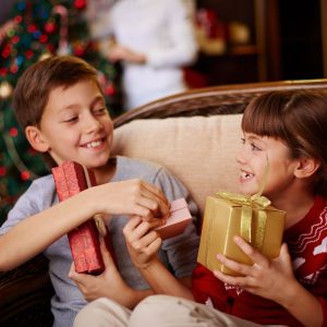 Children opening presents on the holidays